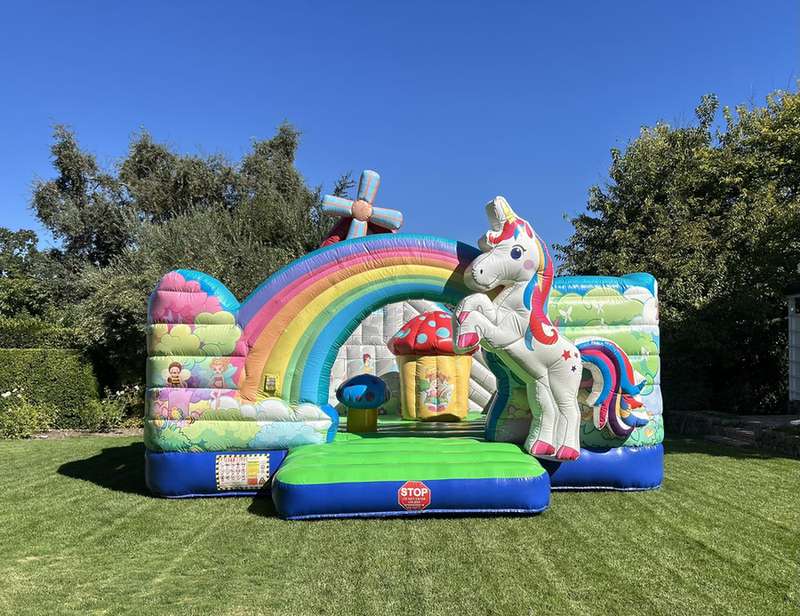 unicorn bounce house with slide to rent