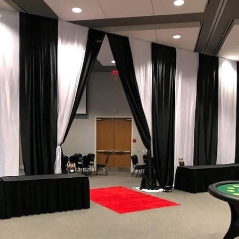 Entrance - Black and White Tall Satin Pipe and Drape with red carpet