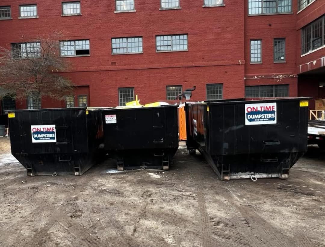 Two dumpsters in front of suburban home Two dumpsters in front of suburban home