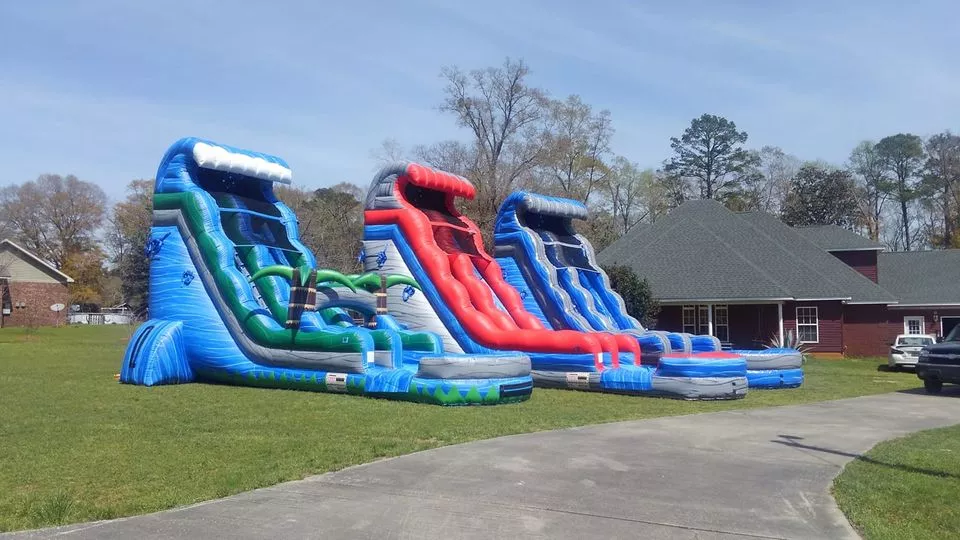 Grey, red, and blue inflatable water slide rental dothan al
