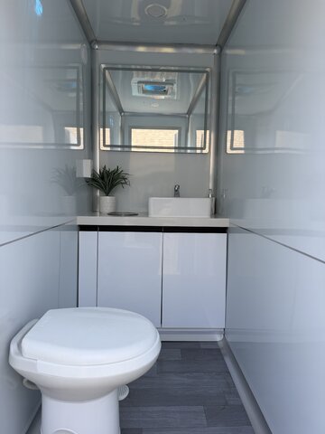 Restroom trailer interior sink and mirror station