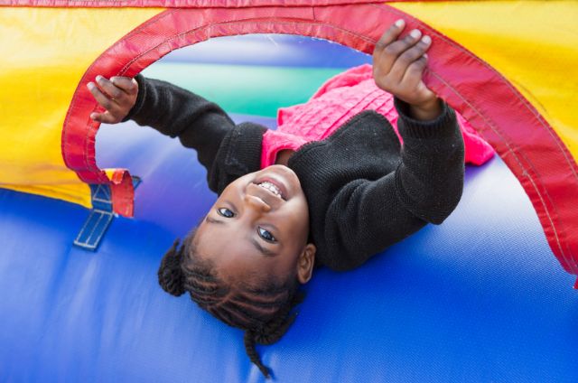 kid enjoying bounce house 