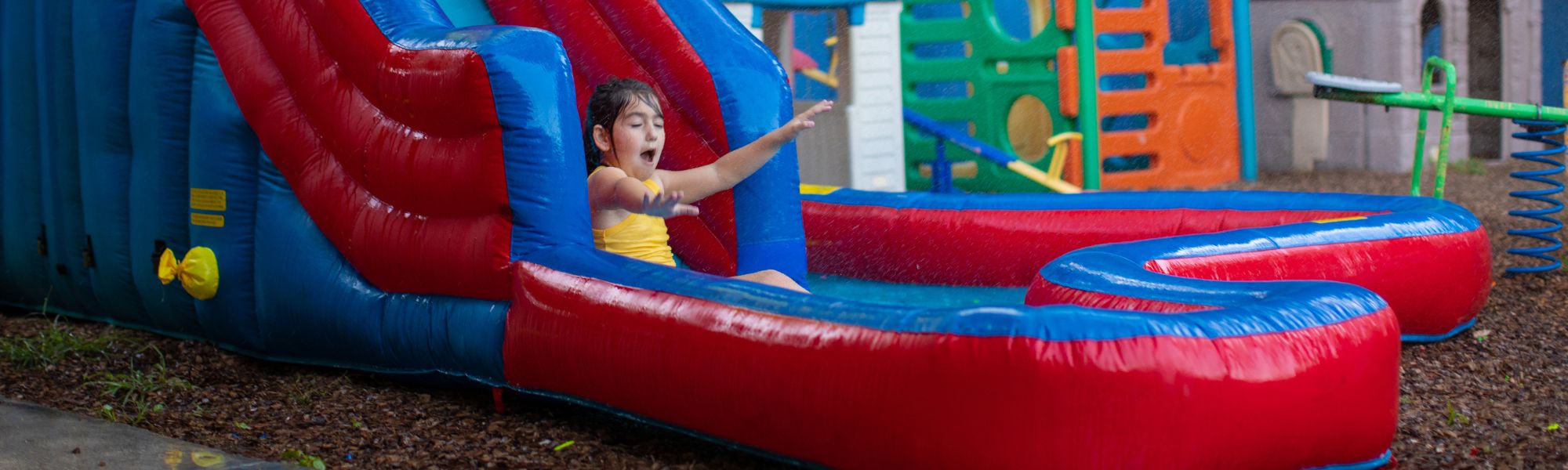kid enjoying water slide