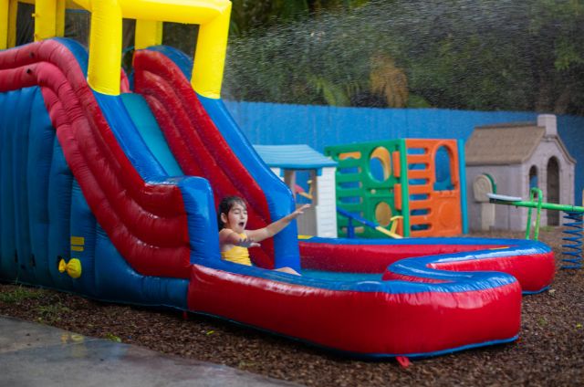 kid enjoying water slide