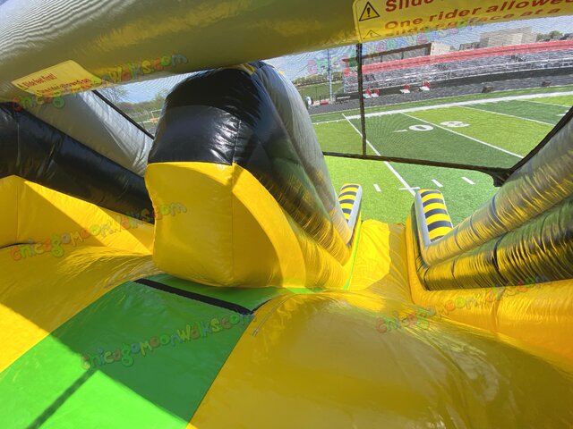Dual lane obstacle course with double slide and climbing wall