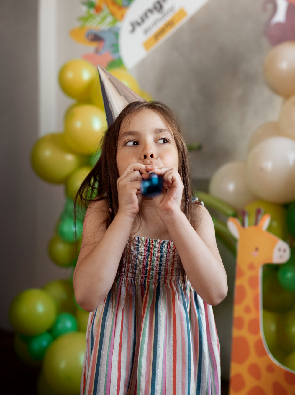 Little girl in a birthday party