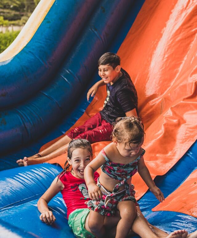 Kids having fun in a safe water slide