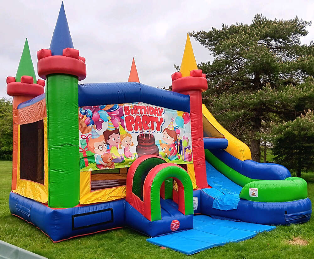 Colorful bounce house rental set up in a backyard by Party Rentals R Us Colorful bounce house rental set up in a backyard by Party Rentals R Us