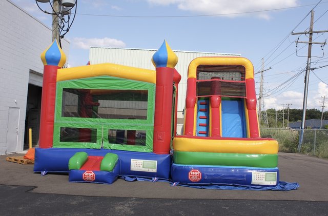 bounce house with slide and basketball hoop