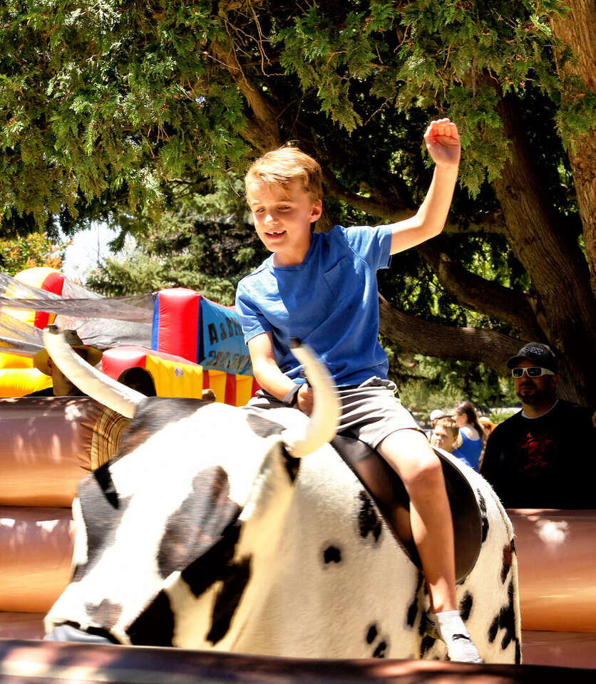 Kid riding a mechanical bull at a Party Jumpers event in Southern California Kid riding a mechanical bull at a Party Jumpers event in Southern California