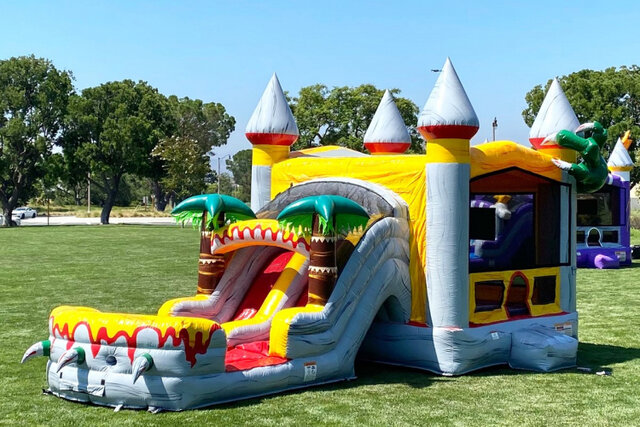 T-REX BOUNCE HOUSE AND SLIDE DUAL LANE COMBO DRY FRONT VIEW