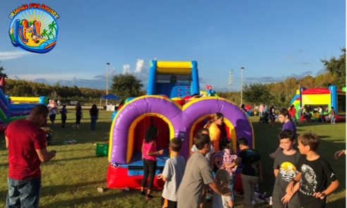 Bounce house rental set up in a backyard by Orlando Fun Bounce.