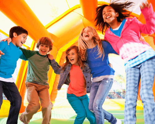 Kids having fun bouncing in a bounce house in Simpsonville, SC – Perfect for parties and events