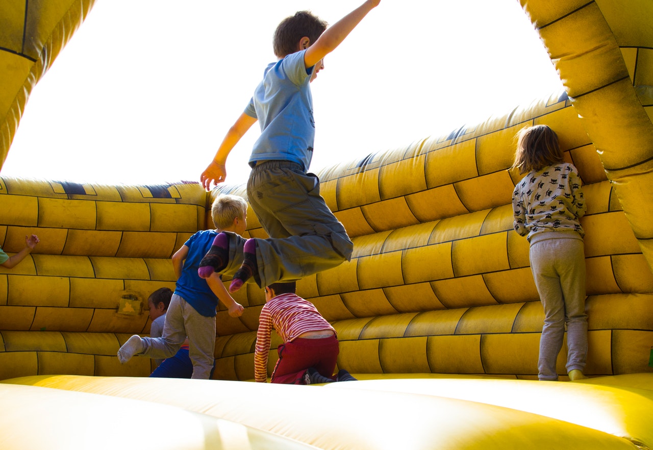 Kids having fun jumping in a bounce house in Greer, SC – Bounce House Rentals for unforgettable events