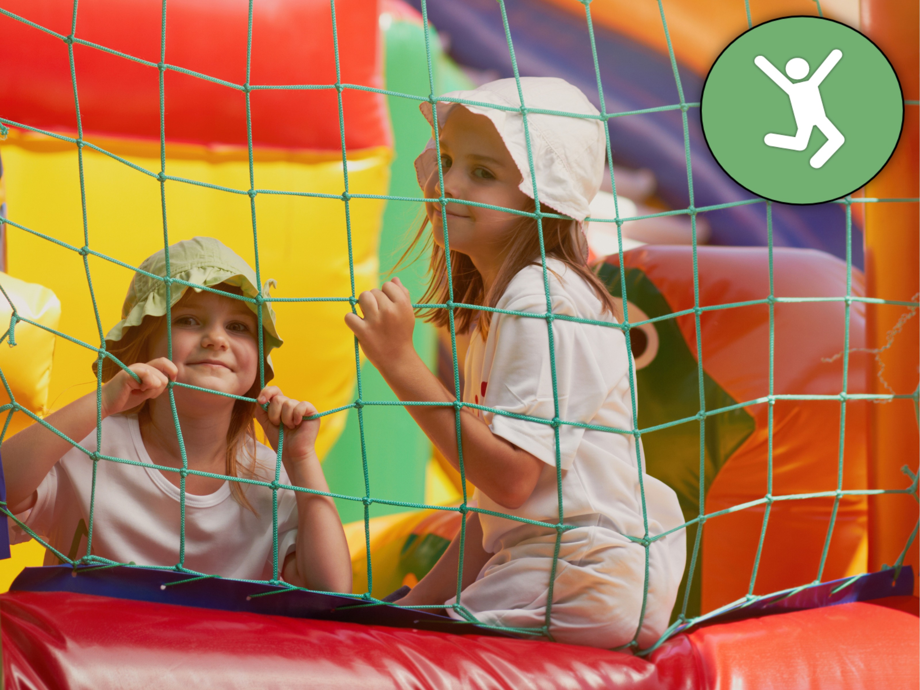 Two smiling girls inside a colorful inflatable at a backyard birthday party, showcasing popular bounce house rentals in Greenville, SC. Two smiling girls inside a colorful inflatable at a backyard birthday party, showcasing popular bounce house rentals in Greenville, SC.