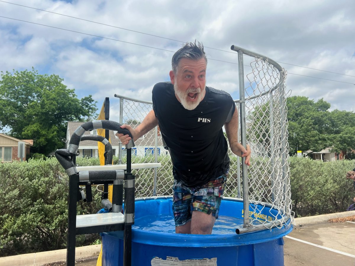 This dunk tank rental in Parker, SC shows a participant climbing out of the blue tank after being dunked at an outdoor school or community event. The enclosed safety cage and sturdy platform make it a classic carnival-style attraction that draws a crowd. Ideal for school fundraisers, church festivals, corporate events, and neighborhood gatherings in Parker, a dunk tank rental creates laughter, friendly competition, and memorable moments for guests of all ages.