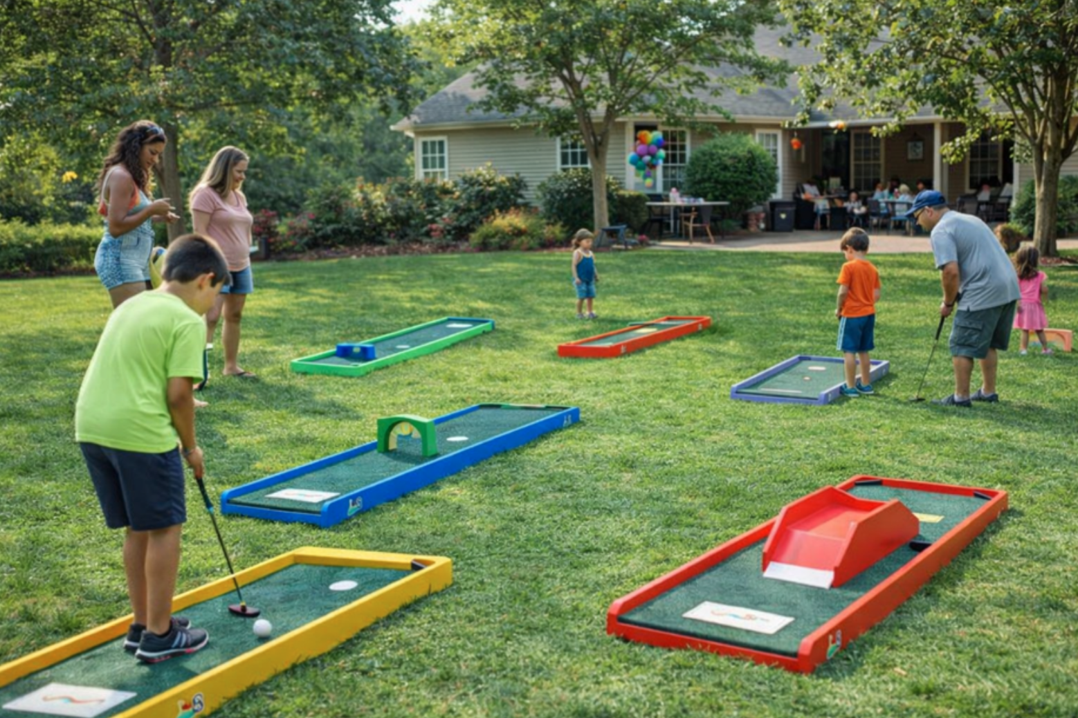 Families enjoying portable mini golf rentals in Travelers Rest, SC at a backyard birthday party with colorful putting lanes and fun outdoor activities. This realistic event setup shows why mini golf rentals in Travelers Rest, South Carolina are a popular choice for birthdays, school events, and family celebrations. Professional delivery and clean equipment make this a standout party attraction.