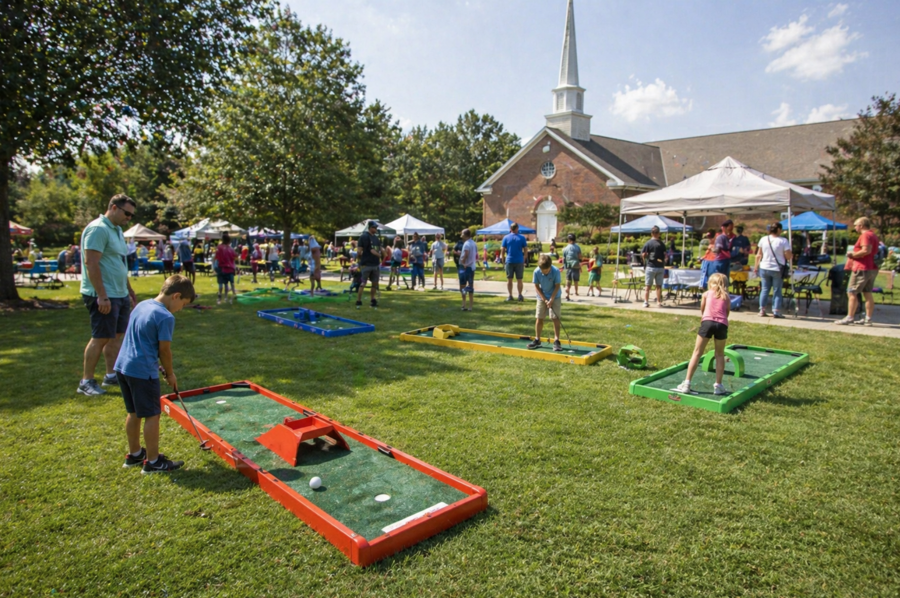 Families enjoying mini golf rentals in Taylors, SC at a church festival with portable lanes placed across a grassy event lawn. Mini golf rentals in Taylors, South Carolina are ideal for church events, school carnivals, and community celebrations. Bright colorful lanes and interactive play make this a memorable attraction.