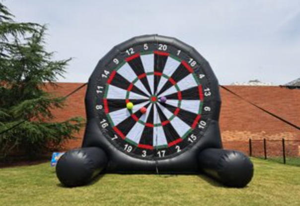 Giant inflatable soccer dart game rental in Simpsonville, SC, set up on a grassy outdoor event space for family-friendly parties, school events, church gatherings, and community celebrations.