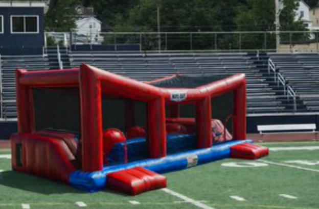 ed and blue inflatable obstacle course with enclosed mesh sides, crawl-through sections, and race-style entry lanes.