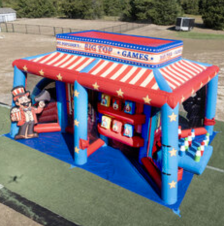 Carnival-style inflatable midway game rental with multiple game stations, striped canopy design, and colorful circus-themed artwork.