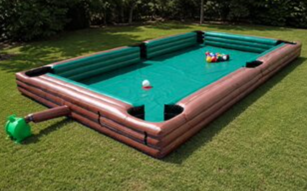 Inflatable billiards game with oversized pool table design, large game balls, and soft inflatable bumper walls.