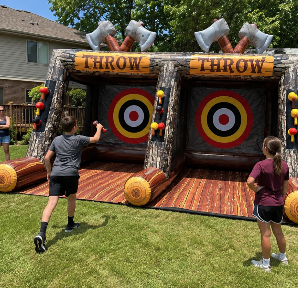 Dual-lane inflatable axe throwing game with bullseye targets set up for an outdoor gathering in Taylors, SC.