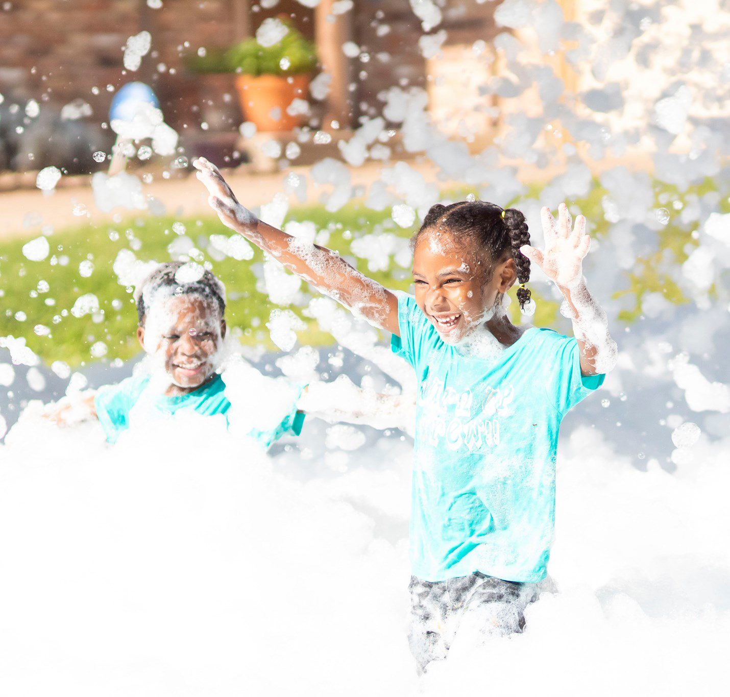 Excited kids running and smiling through bubbles at Foam Parties in Easley, SC. Excited kids running and smiling through bubbles at Foam Parties in Easley, SC.