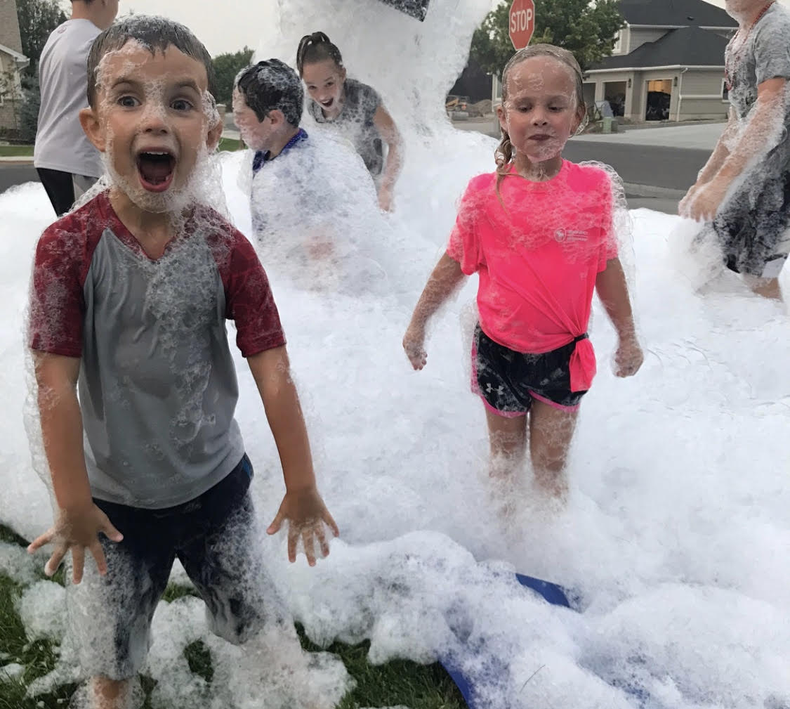 Children laughing and playing in thick foam during one of our foam parties in Greenville, SC. Children laughing and playing in thick foam during one of our foam parties in Greenville, SC.