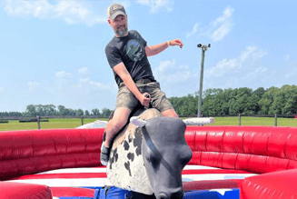 man riding a mechanical bull