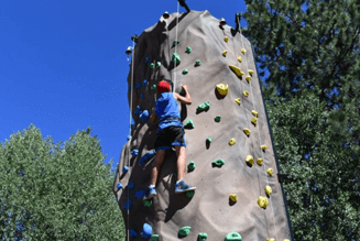 man on a rock climbing wall