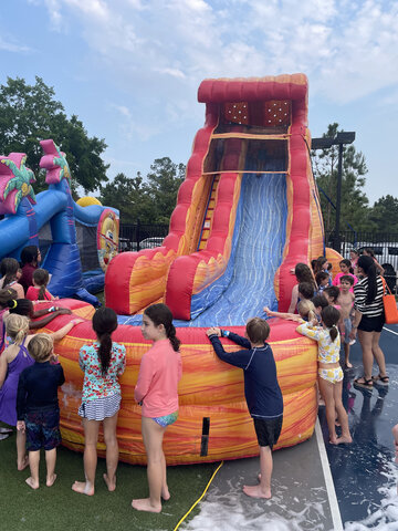 Summer fun in full swing! 🌊🎉 Kids are ready to make a splash at the ultimate water slide!