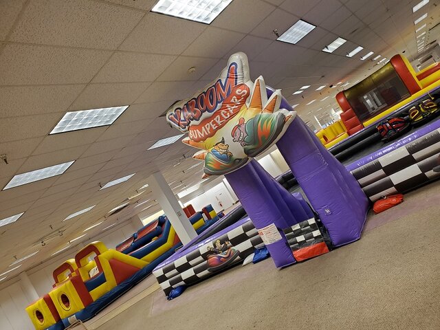 Bumper car rental setup on a concrete surface