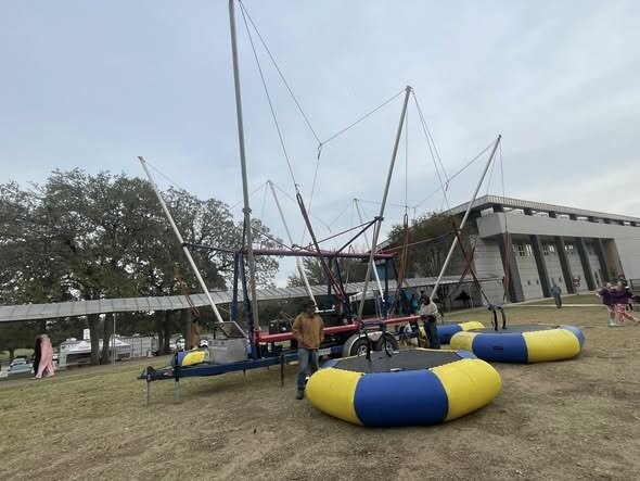 Euro bungee trampoline rental set up at an event venue near Cleburne TX