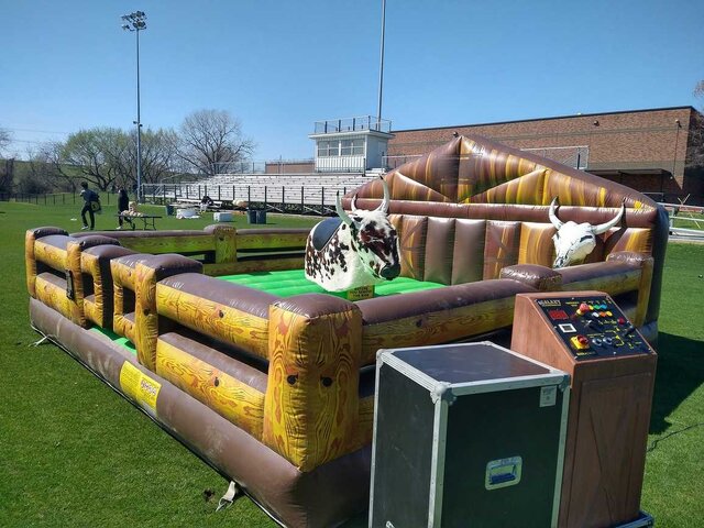 Mechanical bull rental on a Burleson high school field