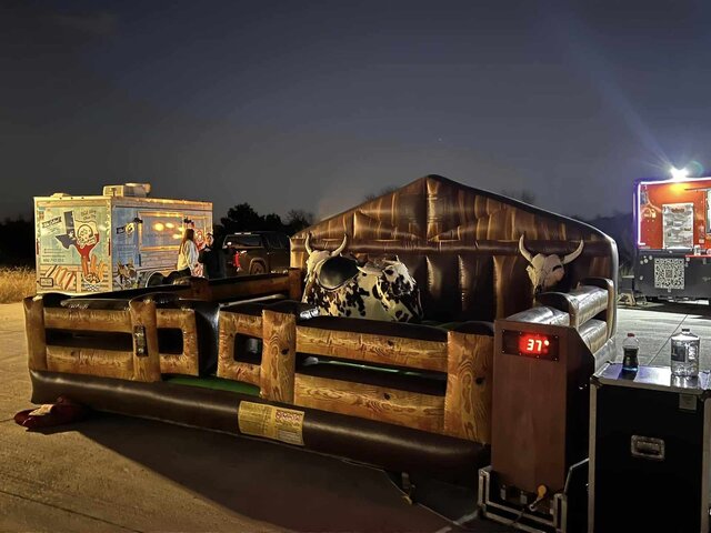 Nighttime mechanical bull rental event in Mansfield, TX