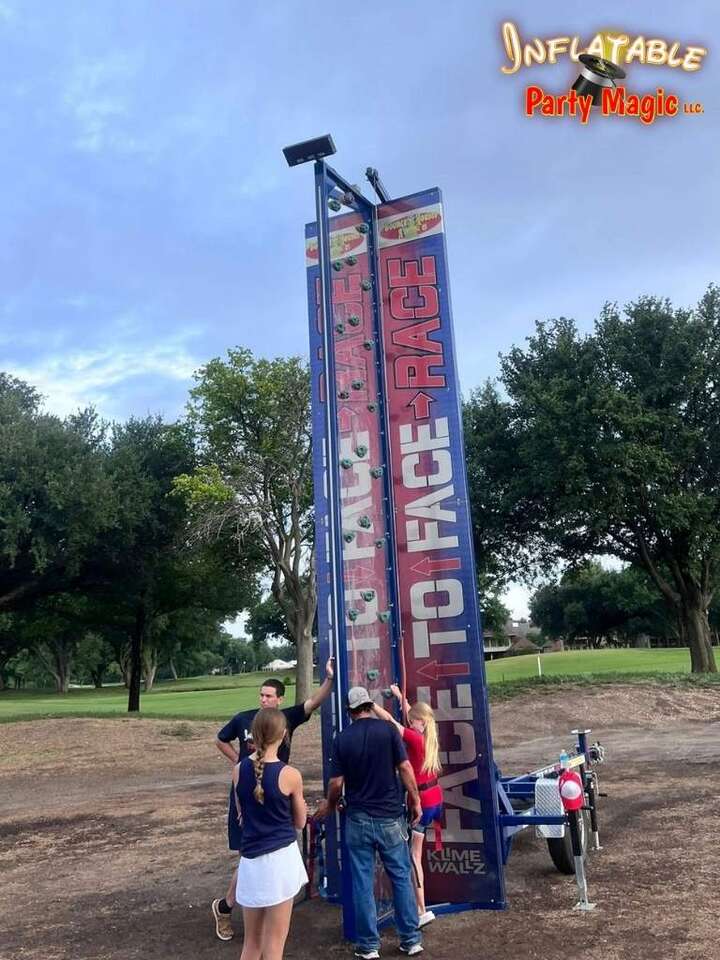 Aledo event rentals showing a Face to Face Rock Climbing wall setup at an event