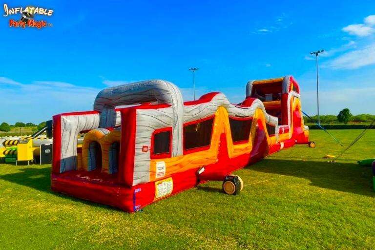 Bounce house obstacle course rental in Granbury at an event