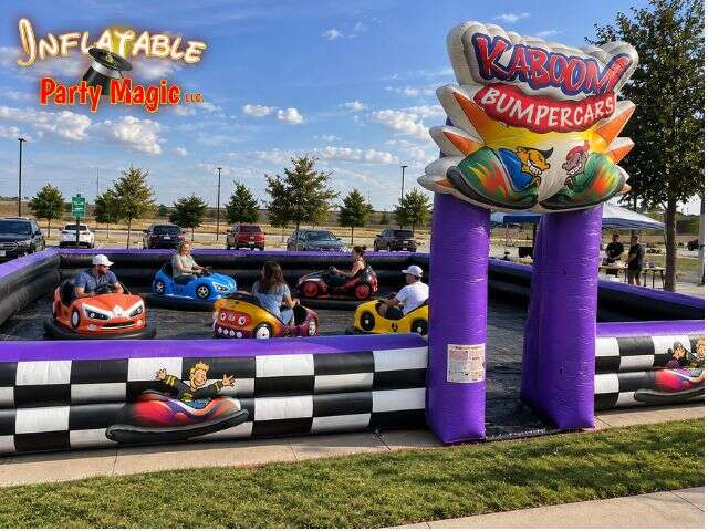 Kids and adults driving rental bumper cars inside the inflatable arena in Grapevine Texas