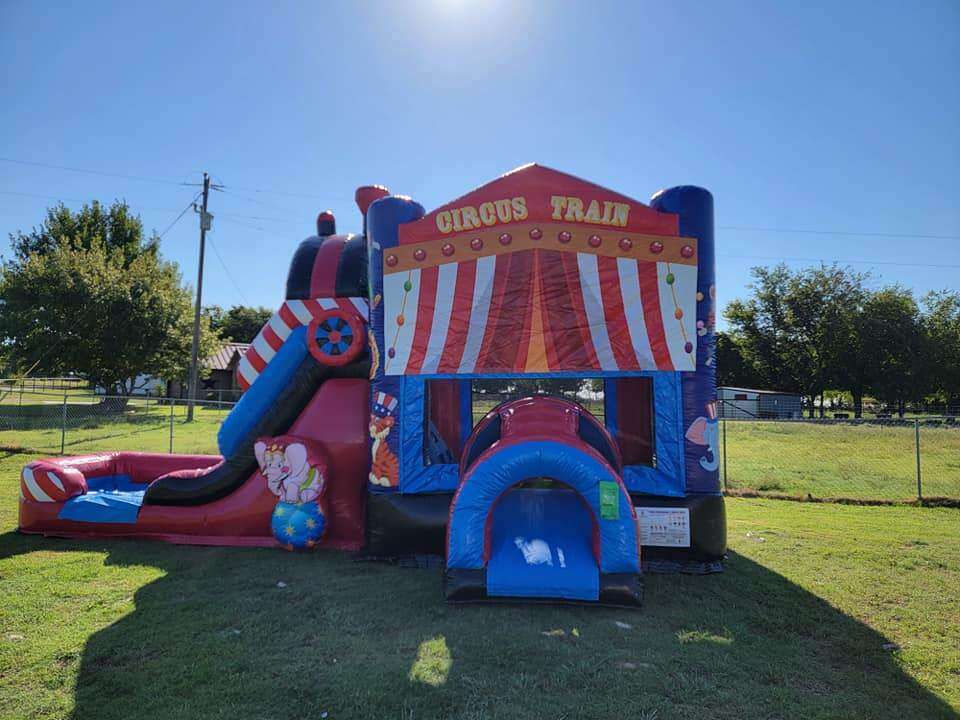 Circus themed bounce house with slide rental for a carnival birthday party in DFW Texas from Inflata…