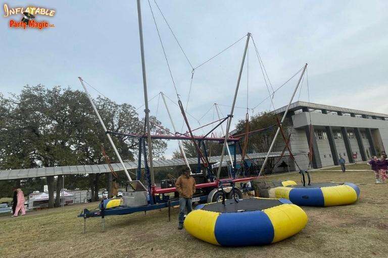 Euro bungee trampoline rental set up at a large community event in Granbury TX