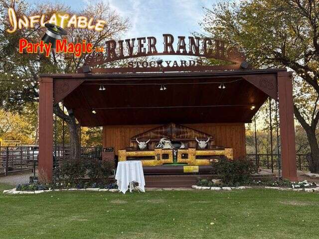 Mechanical bull rental set up inside the River Ranch venue in the Fort Worth Stockyards by Inflatable Party Magic