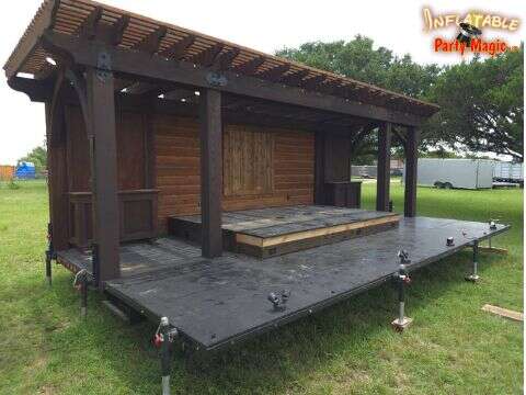 Rustic style event stage rental set up for a band performance at a DFW outdoor event