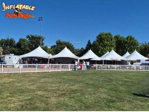 High peak tent rental with tables and chairs set up for an event in Southlake TX by Inflatable Party…