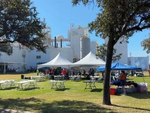 Event tents with tables and chairs set up for a complete outdoor event solution in DFW Texas