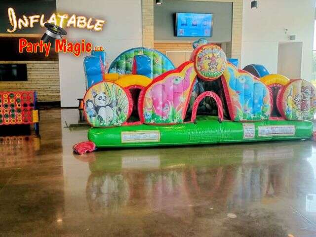 Toddler bounce house and Giant Connect 4 game rental set up at an event in Godley Texas from Inflatable Party Magic