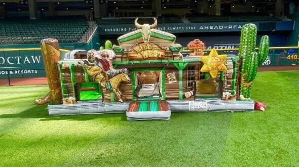 Toddler bounce house rental in a wild west theme showing how to choose the right inflatable for Gran…
