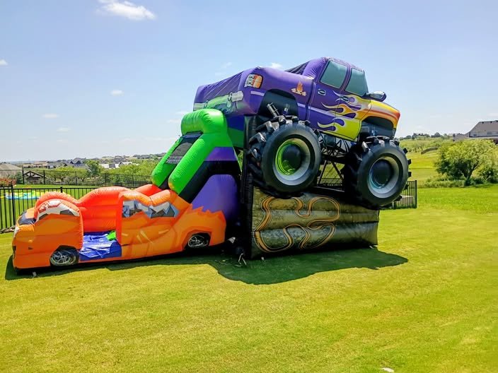 Purple monster truck bounce house and slide combo rental in Cleburne, TX
