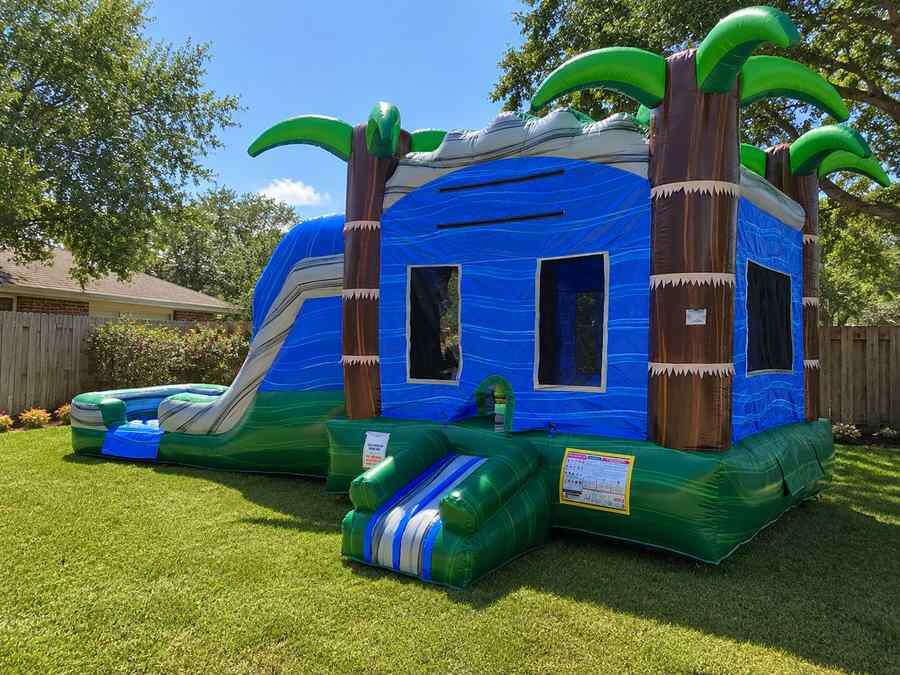 Dual lane bounce house combo with slide rental in DFW from Inflatable Party Magic