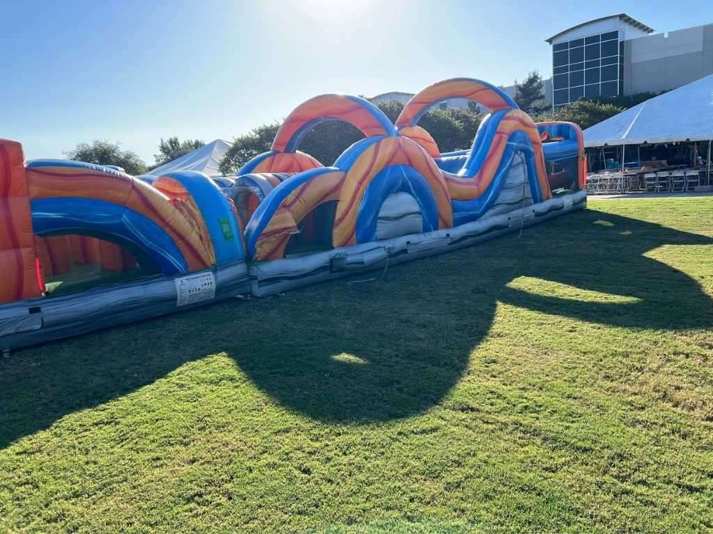 large event rental in Burleson from Inflatable Party Magic featuring an inflatable bounce house obst…